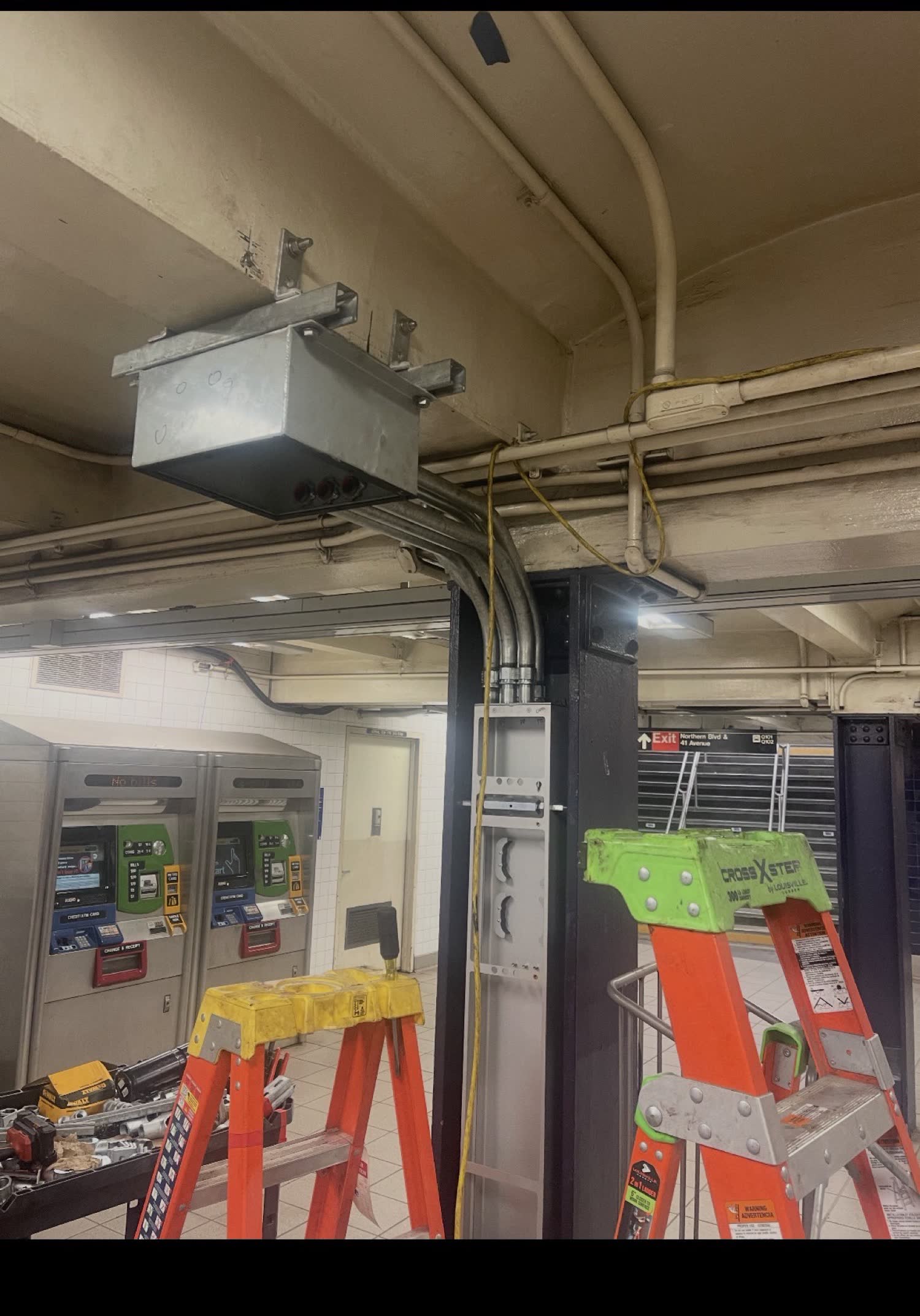 Conduit and junction box install in a transit station