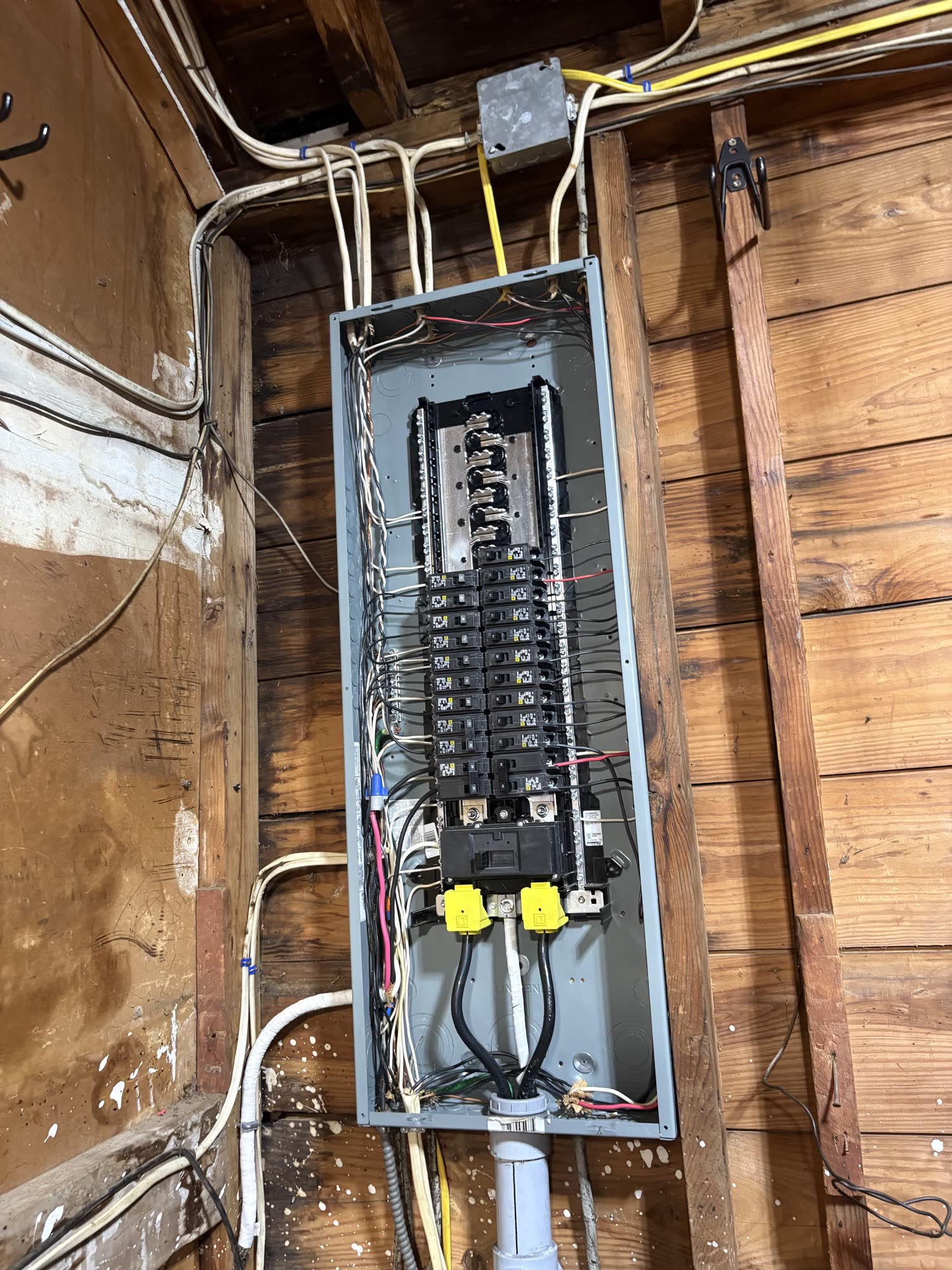 Open residential electrical panel from a John Julius Electric job in a Long Island basement